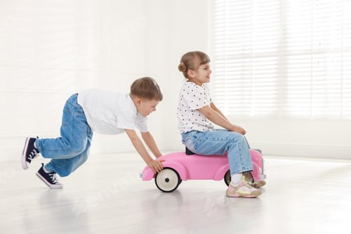Preview: Little children with toy car at home