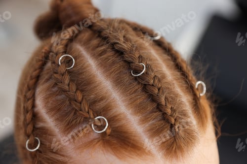 Preview: Teenage girl with beautiful braids indoors, closeup