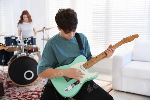Preview: Teenage music band practicing their performance indoors