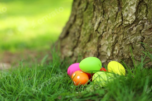Preview: Easter celebration. Painted eggs on green grass, space for text