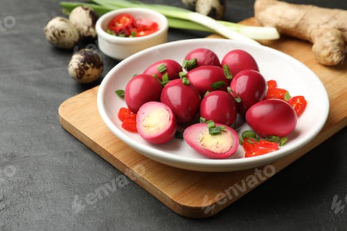 Preview: Pickled quail eggs and ingredients on black table, closeup