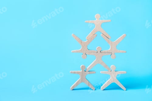 Preview: Wooden human shaped figures on light blue background. Space for text