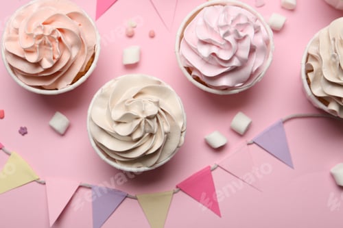 Preview: Delicious birthday cupcakes, bunting flags, marshmallows and sprinkles on pink background, flat lay