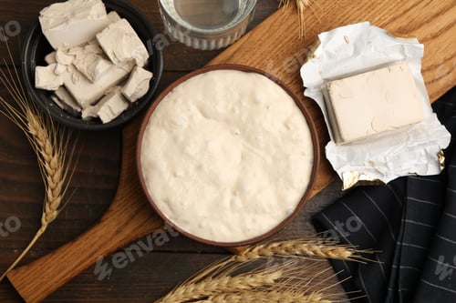 Preview: Fresh yeast dough and ingredients on wooden table, flat lay