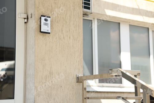 Preview: Modern intercom system on building outdoors, closeup