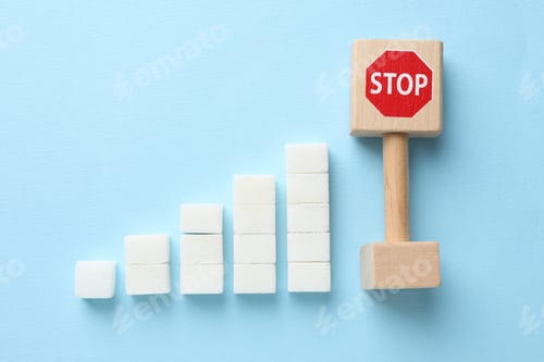 Preview: Control sugar level, diabetes prevention. Stop sign and stacked sugar cubes on light blue background