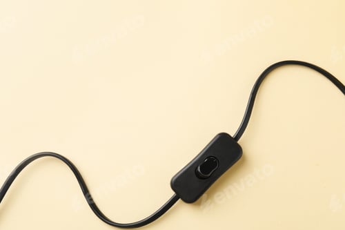 Preview: Cord switch for lamp on beige background, top view. Space for text
