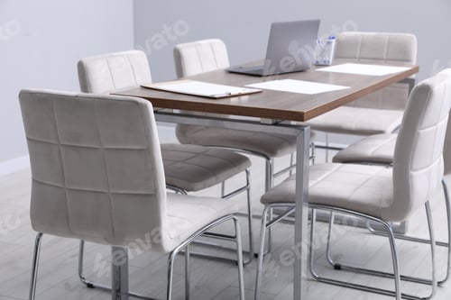 Preview: Stylish chairs and wooden table in office