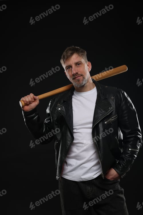 Preview: Brutal man with bat on black background