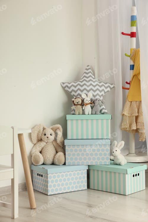 Preview: Different toys and boxes in playroom. Interior design