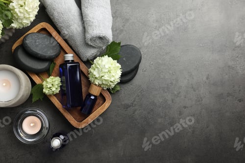 Preview: Flat lay composition with spa products on gray table, space for text