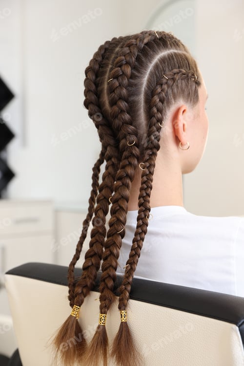 Preview: Teenage girl with beautiful braids in salon