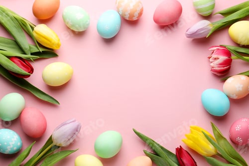 Preview: Frame of painted Easter eggs and beautiful tulips on pink background, flat lay. Space for text