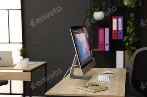 Preview: Wooden desks with computers, stationery, plants and shelving unit in office. Interior design