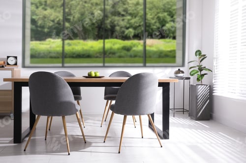 Preview: Table and chairs near window in room. Interior design