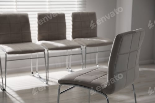 Preview: One chair in front of other seats in office, selective focus