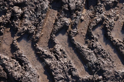 Preview: Muddy road with tire tracks as background, top view
