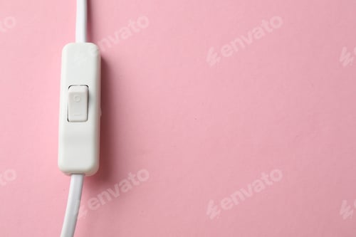 Preview: Cord switch for lamp on pink background, top view. Space for text