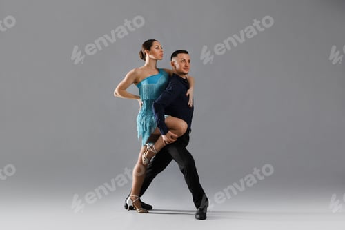 Preview: Couple of professional dancers on grey background