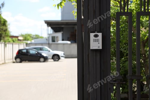 Preview: Modern intercom system on gate outdoors, closeup. Space for text