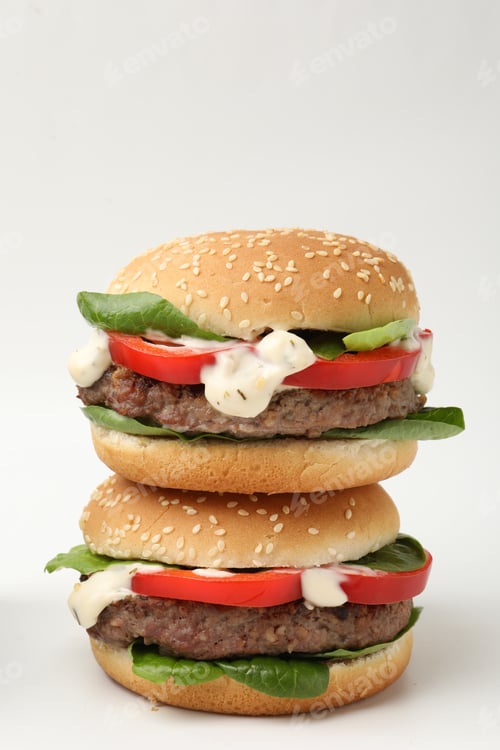 Preview: Delicious burgers with meat patties on white background