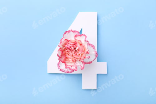 Preview: Paper number 4 and beautiful flower on light blue background, top view