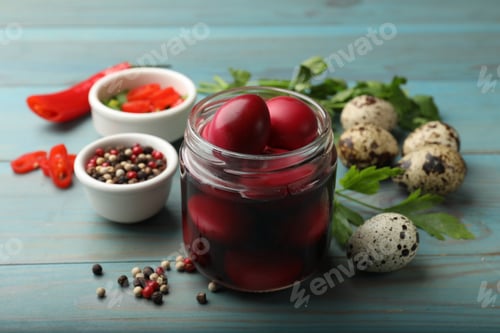 Preview: Pickled quail eggs and ingredients on blue wooden table, closeup