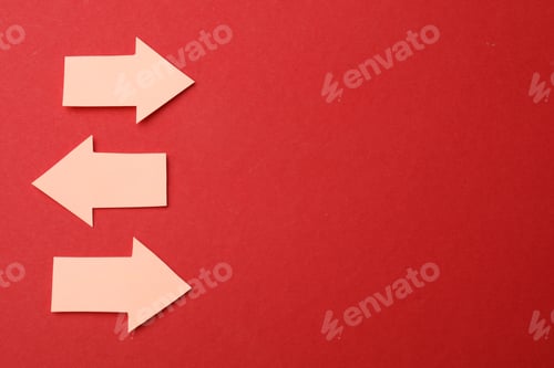 Preview: Beige paper arrows on red background, flat lay. Space for text
