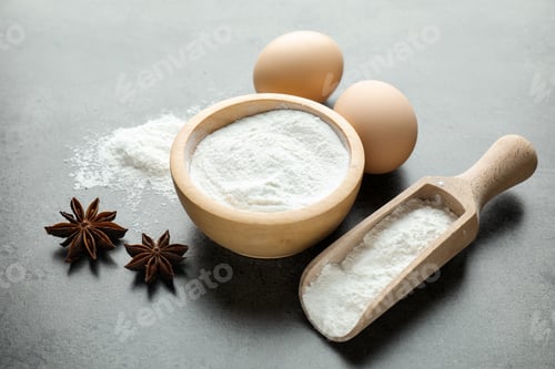 Preview: Baking powder and other ingredients on grey table, closeup