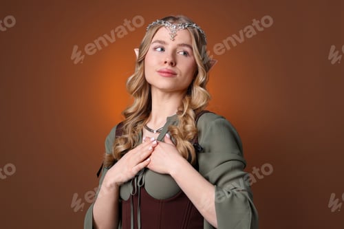 Preview: Beautiful girl dressed as elf on brown gradient background