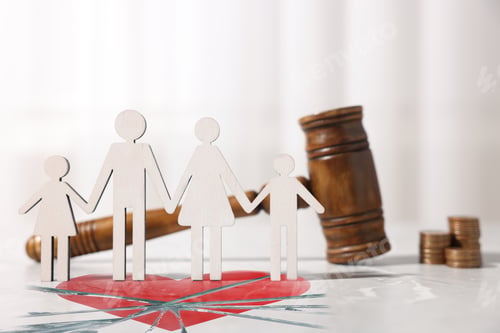 Preview: Divorce and alimony concept. Family figure and judge's gavel on table with broken heart