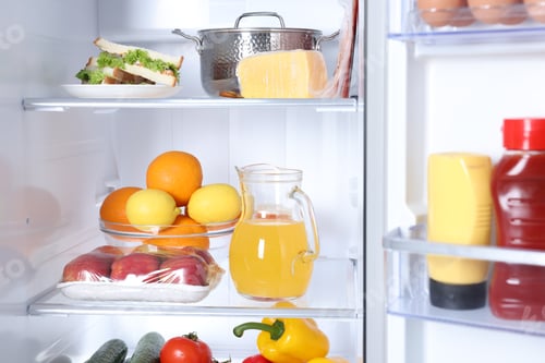 Preview: Modern refrigerator with different fresh food products, closeup