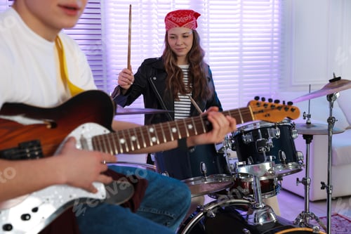 Preview: Teenage music band practicing their performance indoors