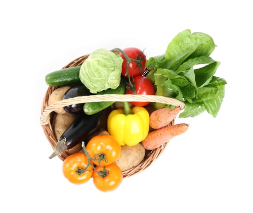 Preview: Fresh vegetables in wicker basket isolated on white, top view
