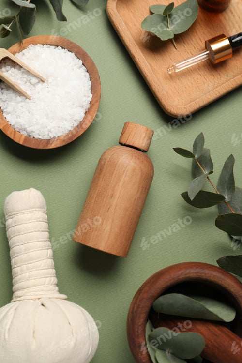 Preview: Different aromatherapy products and eucalyptus leaves on olive background, flat lay
