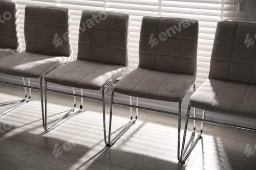 Preview: Many stylish chairs near window in office