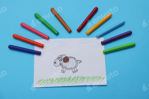 Preview: Drawing and markers on light blue background, flat lay