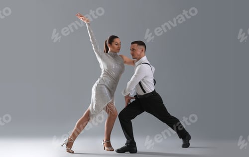 Preview: Couple of professional dancers on grey background