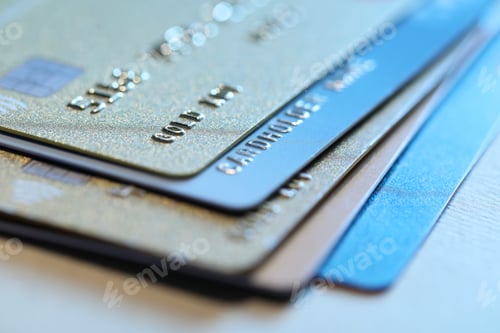Preview: Many credit cards on gray background, closeup view