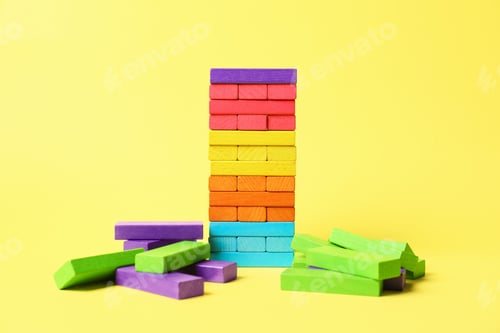 Preview: Tower of colorful blocks on yellow background