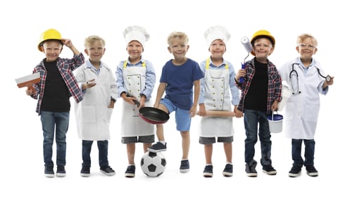 Preview: Little kid in different clothes on white background, collage. Choice of profession. Same boy represe