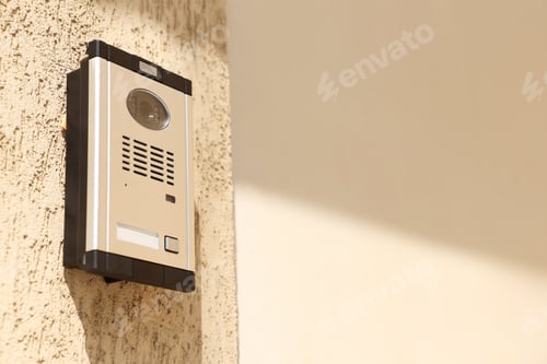 Preview: Modern intercom system on building outdoors, low angle view. Space for text
