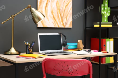 Preview: Stylish workplace with laptop and stationery in child's room