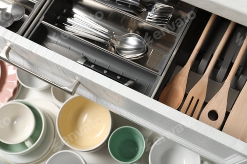 Preview: Ceramic dishware, utensils and cutlery in drawers, top view