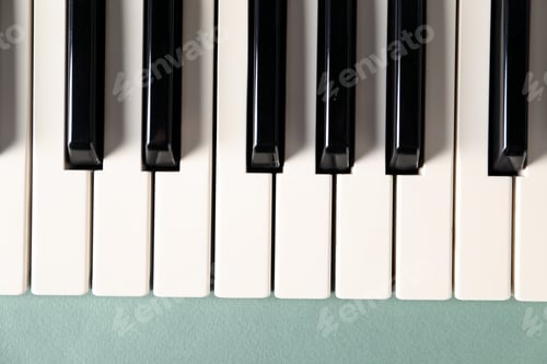 Preview: Piano keys on color background, top view. Musical instrument