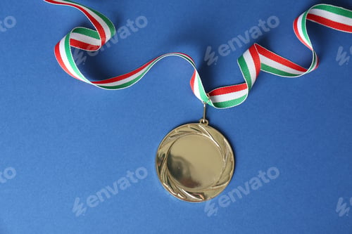 Preview: Gold medal on blue background, top view. Space for design