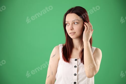 Preview: Woman with color dyed hair on green background, space for text