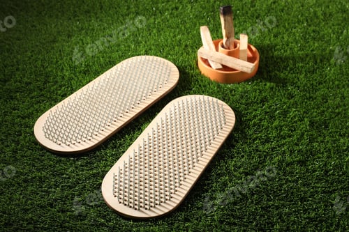 Preview: Standing on nails. Two Sadhu boards and Palo Santo sticks on green grass