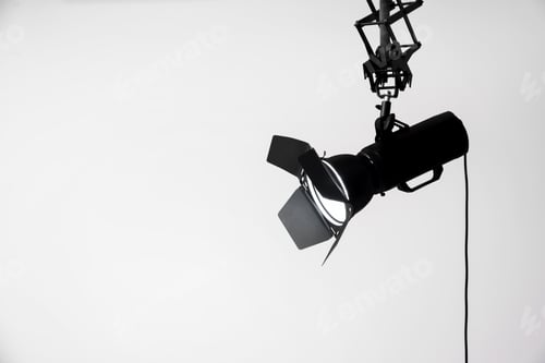 Preview: Professional lighting equipment hanging from ceiling in photo studio, space for text