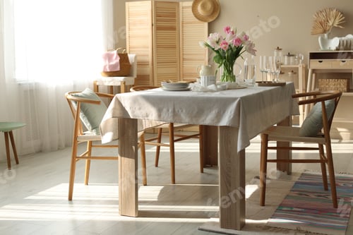 Preview: Beautiful place setting with tulips on table and chairs in stylish dining room
